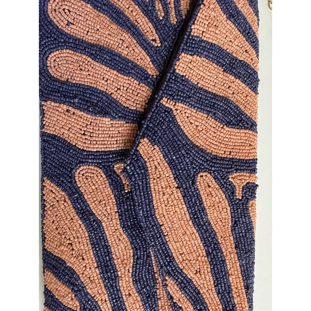 On 34th hand-beaded envelope clutch -navy and coral pink zebra stripe design